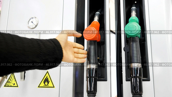 Media.Cylinders with gasoline and gas are taken and then put in place for refueling the car. Стоковое фото, фотограф David Kashakhi / Фотобанк Лори