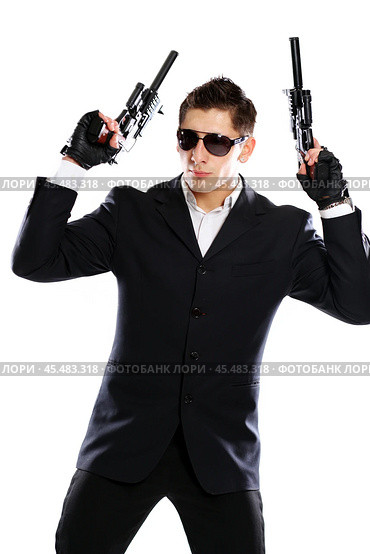 Men in black suit holding gun. Стоковое фото, фотограф Андрей Аркуша / Фотобанк Лори