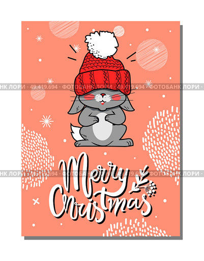 Merry Christmas funny postcard with gray hare in red woolen hat with bubo taut over eyes. Vector illustration with congratulation from cute animal. Merry Christmas Funny Postcard Vector illustration. Стоковая иллюстрация, агентство Ingram Publishing / Фотобанк Лори