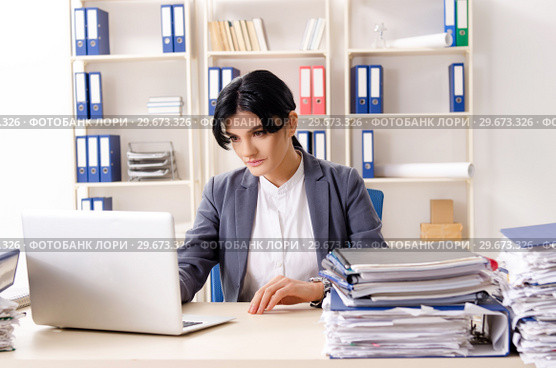Middle aged businesslady unhappy with excessive work. Стоковое фото, фотограф Elnur / Фотобанк Лори