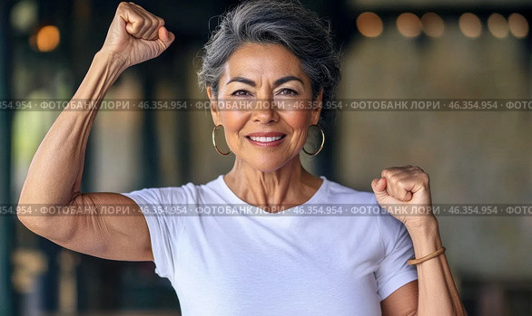 Middle aged hispanic woman with raised fist of empowerment, strength and women solidarity, International Womens Day concept. Стоковое AI-изображение, AI-художник Анастасия Золотницкая / Фотобанк Лори