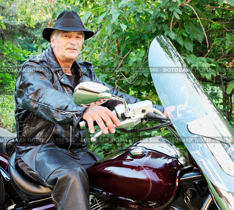Middle-Aged Man Riding Motorcycle. Стоковое фото, фотограф Denis Pepin / PantherMedia / Фотобанк Лори