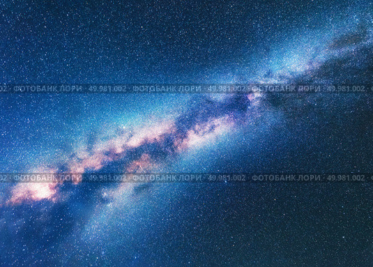 Milky Way. Space background with starry sky. Fantastic night landscape with bright milky way, blue sky full of stars. Shiny stars. Beautiful scene with universe. Astrophotography. Galaxy. Стоковое фото, агентство Ingram Publishing / Фотобанк Лори