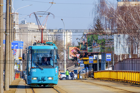Minsk, Belarus - March 25, 2022: A tram moves along the rails on Chapaev Street in Minsk. The model of the tram AKSM-60102 of Belarusian production. Редакционное фото, фотограф Denis Shitikoff / Фотобанк Лори