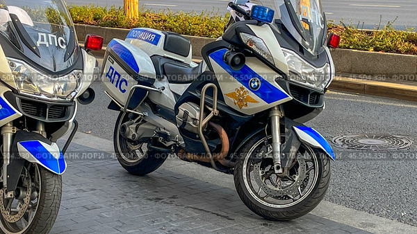 Moscow November 24 2024, Two motorcycles with blue and white colors and the letters NBC on them. Редакционное фото, фотограф Скрипачев Антон / Фотобанк Лори