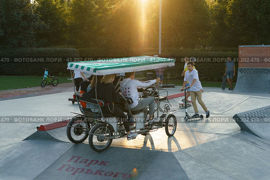 Moscow, Russia - August 28, 2019: Dangerous travel in the Gorky park. Human-powered vehicle with four wheels (quard) on the sports ground. Редакционное фото, фотограф YuryKara / Фотобанк Лори