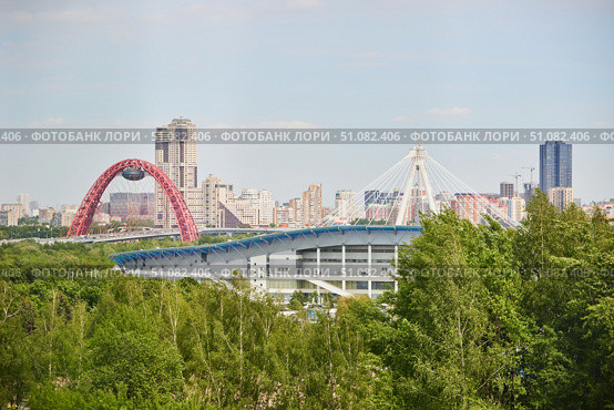 Moscow, Russia. - May 26, 2025: View of Moscow's high-rise buildings and stadiums from the Krylatsky Hills. Редакционное фото, фотограф Наталия Кирсанова / Фотобанк Лори