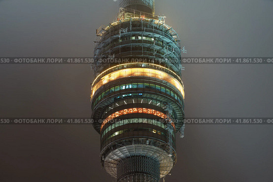 Moscow, Russia- May 29, 2020:Ostankino tv tower details in rainy sky. The high technology in everyday life. Telephoto lens. Редакционное фото, фотограф YuryKara / Фотобанк Лори