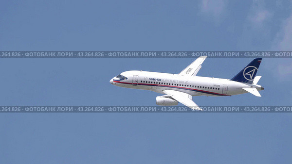 Moscow Russia Zhukovsky Airfield 25 July 2021: Commercial passenger airplane Sukhoi Superjet 100 flying demonstration flight of the international aerospace salon MAKS-2021. Стоковое фото, фотограф Фотограф / Фотобанк Лори