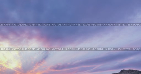 Mountain lake time lapse in summer or autumn. Wild nature and beautiful sunset. Moving clouds, deep twilight and dramatic sky. Стоковое видео, видеограф Александр Маркин / Фотобанк Лори