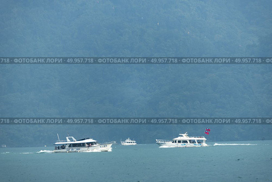 Nantou, Taiwan - November 02, 2016 : Tourist boats docking in peachful morning at Shuishe Pier, Sun Moon Lake, Taiwan. Редакционное фото, агентство Ingram Publishing / Фотобанк Лори