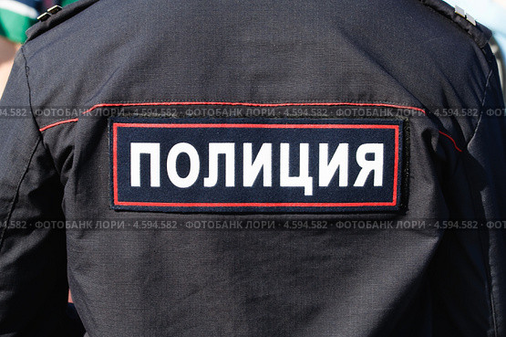Нашивка на спине "Полиция" Стоковое фото, фотограф Алёшина Оксана / Фотобанк Лори