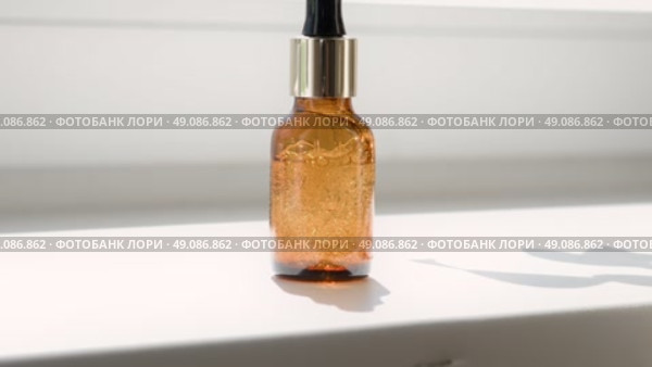 Natural oil cosmetics. Dropper glass amber Bottle Mock-Up. Oily cosmetic pipette. Face and body treatment. Spa concept. Mineral organic liquid. Front view. Beauty products. Blank packaging on white. Стоковое видео, видеограф Марина Демидюк / Фотобанк Лори