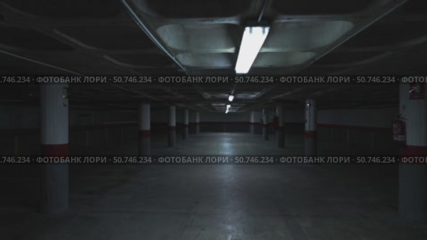 Neon lights flickering in empty parking garage. Стоковое видео, видеограф Данил Руденко / Фотобанк Лори
