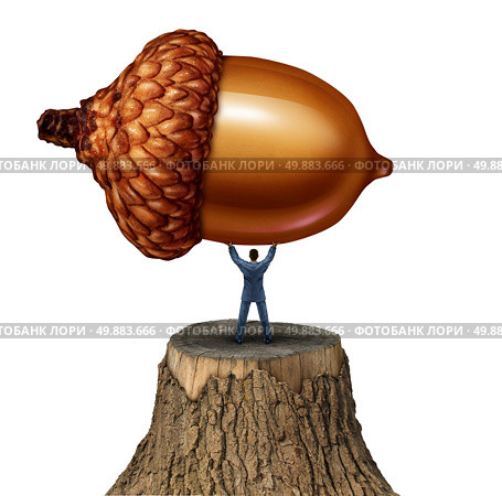 New investment business concept as a businessman standing on a cut tree stump lifting up a giant acorn as a metaphor for investing in the future and reviving old industry through long term planning. Стоковое фото, агентство Ingram Publishing / Фотобанк Лори