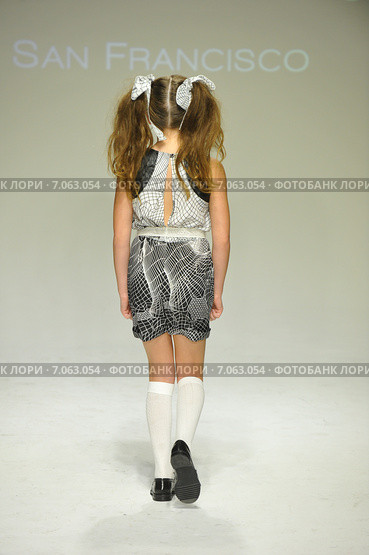 NEW YORK, NY - OCTOBER 18: A model walks the runway during the Alivia Simone preview at petite PARADE Kids Fashion Week at Bathhouse Studios on October 18, 2014 in New York City. Редакционное фото, фотограф Anton Oparin / Фотобанк Лори