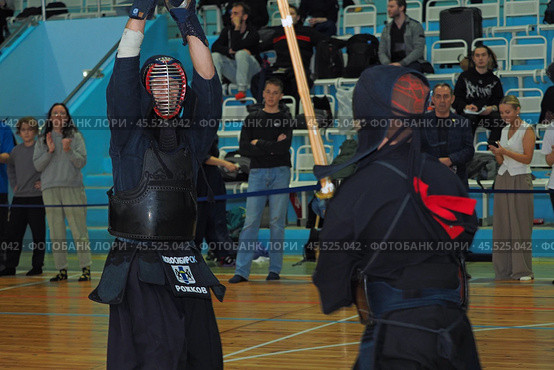 Nizhny Novgorod, Russia, 11.24.2024 Gagarin Avenue 25 d Russian Kendo Championship. Athletes in protective equipment with a sword and a protective helmet at competitions. Редакционное фото, фотограф Egor Sarantstv / Фотобанк Лори