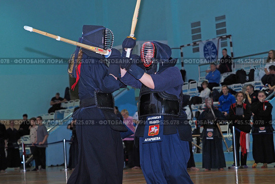 Nizhny Novgorod, Russia, 11.24.2024 Gagarin Avenue 25 d Russian Kendo Championship. Athletes in protective equipment with a sword and a protective helmet at competitions. Редакционное фото, фотограф Egor Sarantstv / Фотобанк Лори