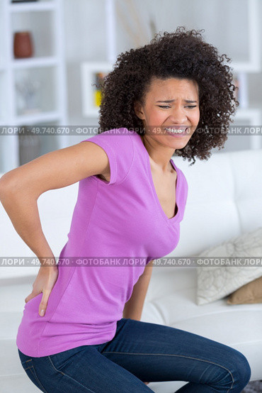 office worker sufffering from back pain. Стоковое фото, агентство Ingram Publishing / Фотобанк Лори