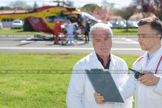 old doctor and a mobile flying ambulance. Стоковое фото, агентство Ingram Publishing / Фотобанк Лори