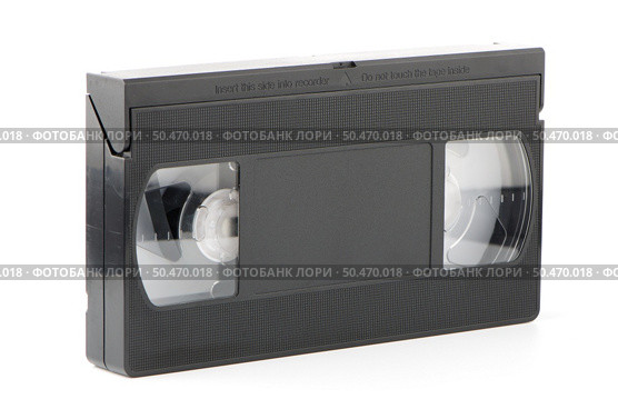 Old VHS Video tape isolated on white background. Стоковое фото, агентство Ingram Publishing / Фотобанк Лори