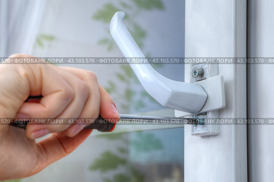 On double hung window, dismantle handle to supply restrictor that adjusts width of opening. Стоковое фото, фотограф Владимир Григорьев / Фотобанк Лори