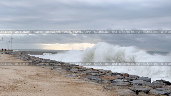 OVAR, PORTUGAL - 31 OCTOBER 2023: The sea rises to the seafront of Furadouro in Ovar. The advance of the sea due to climate change threatens Portugal. Стоковое фото, агентство Ingram Publishing / Фотобанк Лори