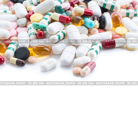 packings of pills and capsules of medicines on white background. Стоковое фото, агентство Ingram Publishing / Фотобанк Лори