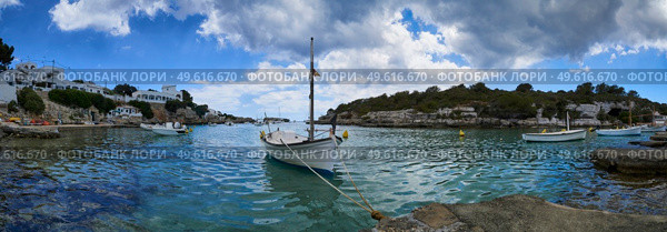 Panorama of small boats moored in the Mediterranean cove of Cala Alcaufar,Menorca, Стоковое фото, агентство Ingram Publishing / Фотобанк Лори