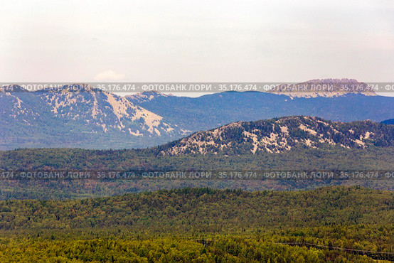 panorama of the Ural mountains of the Taganai ridge of the Chelyabinsk region view from the Aleksandrovskaya Sopka on a sunny summer day. Стоковое фото, фотограф Акиньшин Владимир / Фотобанк Лори