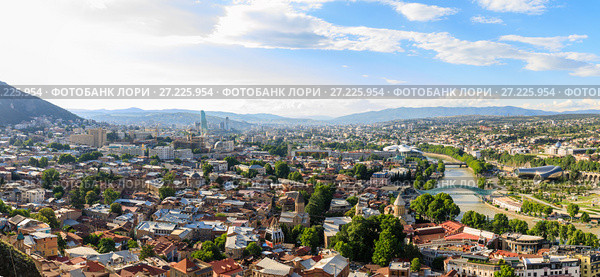 Panoramic view of Tbilisi city from the Saint mount (Mtatsminda), old town and modern architecture. Tbilisi the capital of Georgia. Стоковое фото, фотограф Mikhail Starodubov / Фотобанк Лори