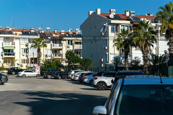 Parked cars near the apartments in the Lara area. Antalya. Turkey. 03.01.2023. Редакционное фото, фотограф Ярославский Максим / Фотобанк Лори
