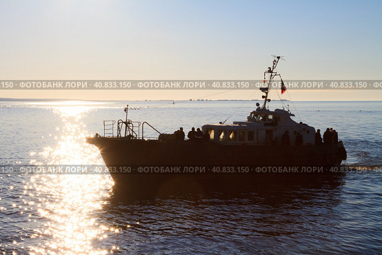 Passenger boat sailing on the estuary. Water transport and passenger transportation. Crossing the river by ship. Anadyr estuary, Chukotka, Siberia, Far East of Russia. Стоковое фото, фотограф Андрей Степанов / Фотобанк Лори