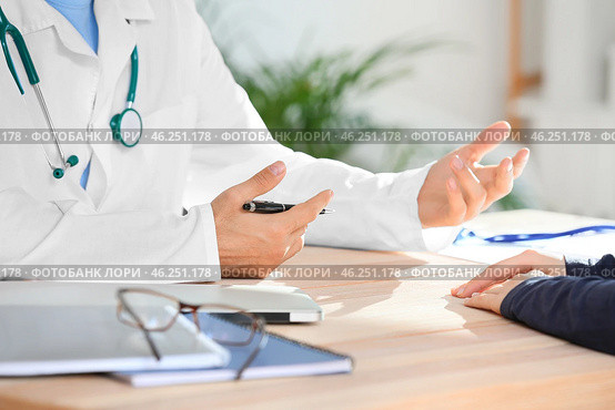 Patient visiting doctor in clinic, closeup. Стоковое фото, фотограф Pixel_shot / Фотобанк Лори