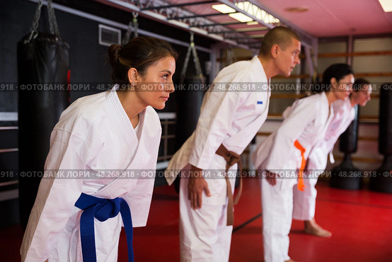 People in kimono bowing during karate training. Стоковое фото, фотограф Яков Филимонов / Фотобанк Лори