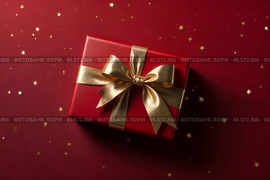 Perfect red Christmas present gift box with elegant gold bow ribbon on red background near stars. Greeting gift symbolize lovely holiday gifting. Birthday Christmas festive concept. Copy ad text space. Стоковое AI-изображение, AI-художник Aleksandr Golubev / Фотобанк Лори