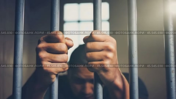 Person behind bars with sense of confinement and longing for freedom. Barrier to liberation. Prisoner young man in prison. Стоковое AI-видео, аниматор Igor Tichonow / Фотобанк Лори