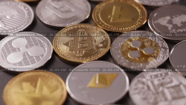 Physical metal cryptocurrency on a dark background. Digital coins cyberspace. Slow motion. 1080p Full HD video. Стоковое видео, видеограф Ярослав Данильченко / Фотобанк Лори