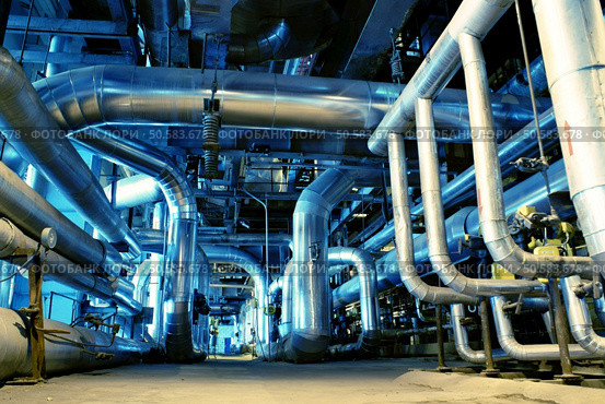 Pipes, tubes, machinery and steam turbine at a power plant  . Стоковое фото, агентство Ingram Publishing / Фотобанк Лори
