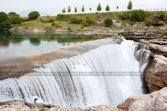 Plain waterfall of the Cijevna river. It is called Montenegrin Niagara Falls. Surroundings of Podgorica city. Montenegro, Europe. Стоковое фото, фотограф Кекяляйнен Андрей / Фотобанк Лори