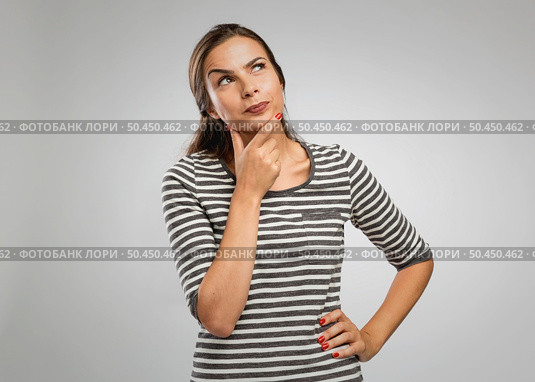 Portrait of a beautiful woman with a thinking expression. Стоковое фото, агентство Ingram Publishing / Фотобанк Лори