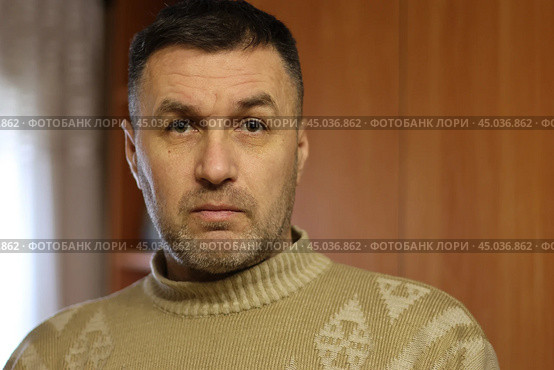 Portrait of a thoughtful and surprised middle-aged man in a wool sweater close-up. Стоковое фото, фотограф Андрей С / Фотобанк Лори