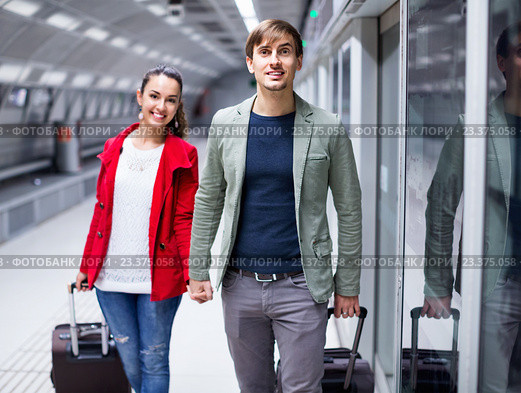 Portrait of couple with wheeled trollers. Стоковое фото, фотограф Яков Филимонов / Фотобанк Лори