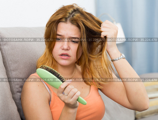 Portrait of female who is unhappy because her hair was deteriorated. Стоковое фото, фотограф Яков Филимонов / Фотобанк Лори