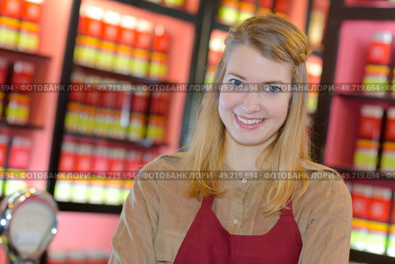 portrait of happy female seller in pharmaceutical store. Стоковое фото, агентство Ingram Publishing / Фотобанк Лори