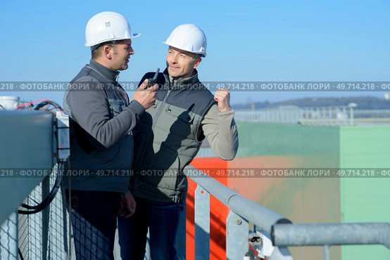 portrait of laborers outside a factory. Стоковое фото, агентство Ingram Publishing / Фотобанк Лори