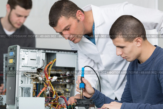 portrait of people soldering iron and microcircuit. Стоковое фото, агентство Ingram Publishing / Фотобанк Лори