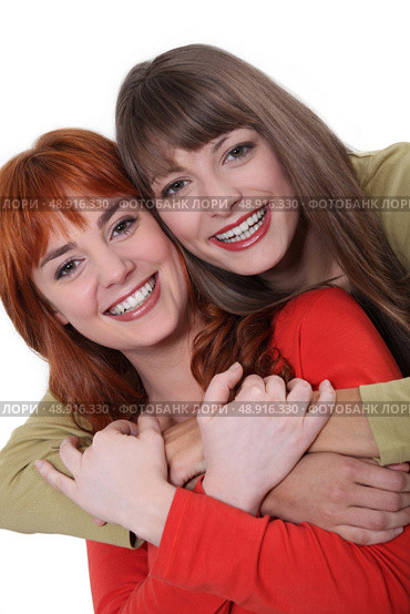 Portrait of smiling sisters. Стоковое фото, агентство Ingram Publishing / Фотобанк Лори