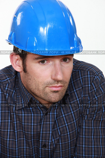 Portrait of tradesman lacking self-confidence. Стоковое фото, агентство Ingram Publishing / Фотобанк Лори