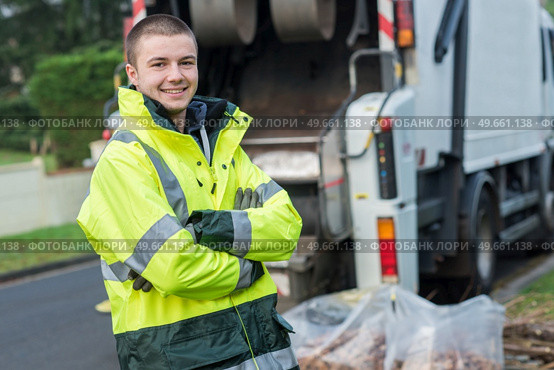 portrait of young smiling refuse collector. Стоковое фото, агентство Ingram Publishing / Фотобанк Лори